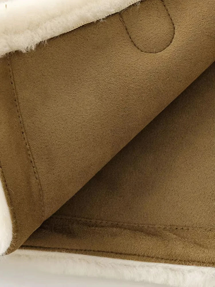 Warm faux fur jacket with long sleeves and front toggle.